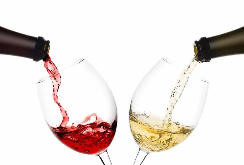Two wine bottles pouring red and white wine into two separate wine glasses